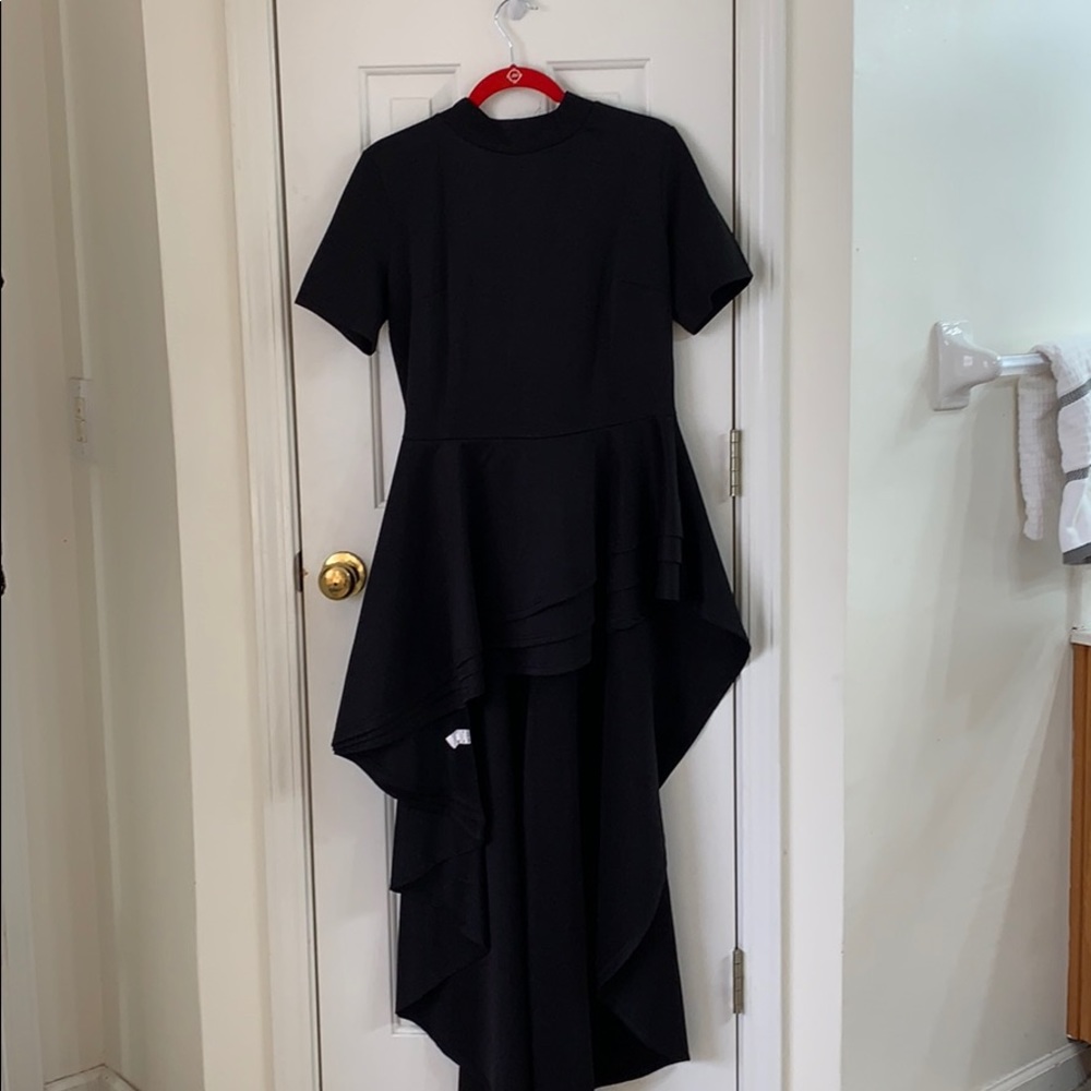 This is a ruffled black dress that fits a size 2xL